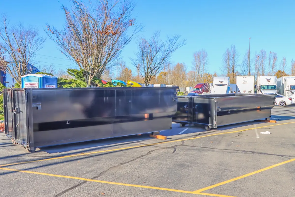 Professional dumpster rental service with roll-off container on residential driveway in Windcrest